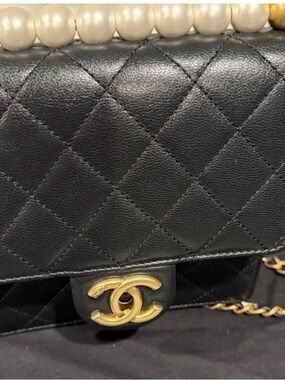 CHANEL Black Quilted Leather Shoulder Bag with Gold CC and Pearl Handle